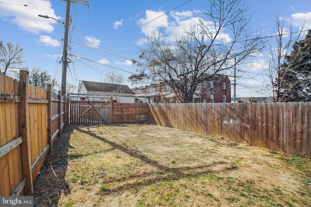 view of yard with a fenced backyard