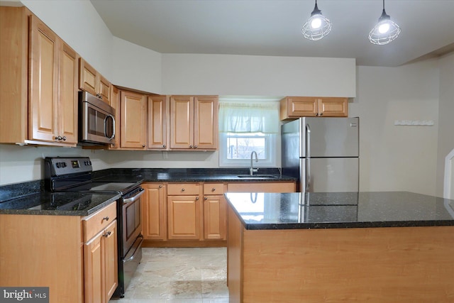 kitchen featuring hanging light fixtures, appliances with stainless steel finishes, sink, and dark stone counters