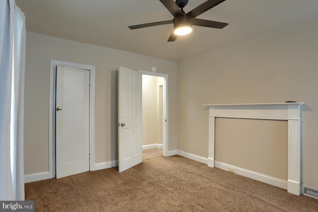 unfurnished bedroom with ceiling fan and carpet flooring