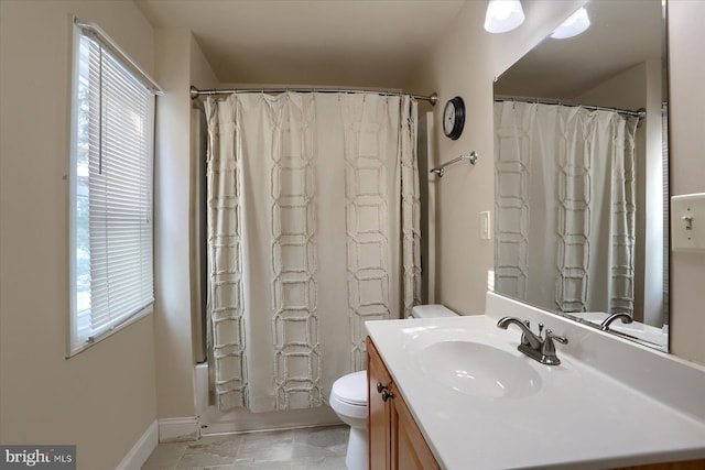 full bathroom with toilet, vanity, shower / bath combo, and a wealth of natural light