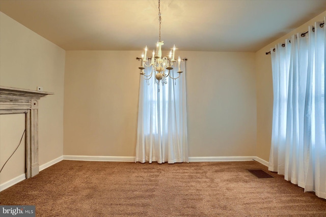 unfurnished dining area with an inviting chandelier and carpet floors