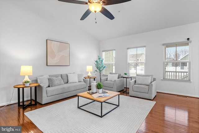 living room featuring hardwood / wood-style flooring, vaulted ceiling, a healthy amount of sunlight, and ceiling fan