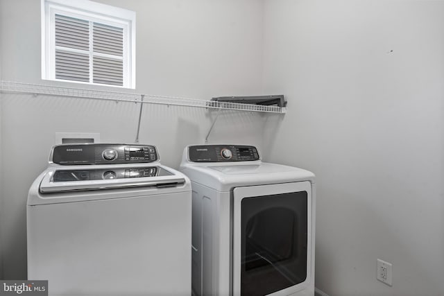 laundry room featuring washing machine and dryer