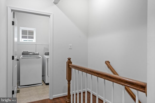 staircase with washer and dryer