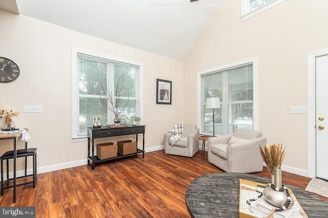 sitting room with lofted ceiling and dark hardwood / wood-style floors