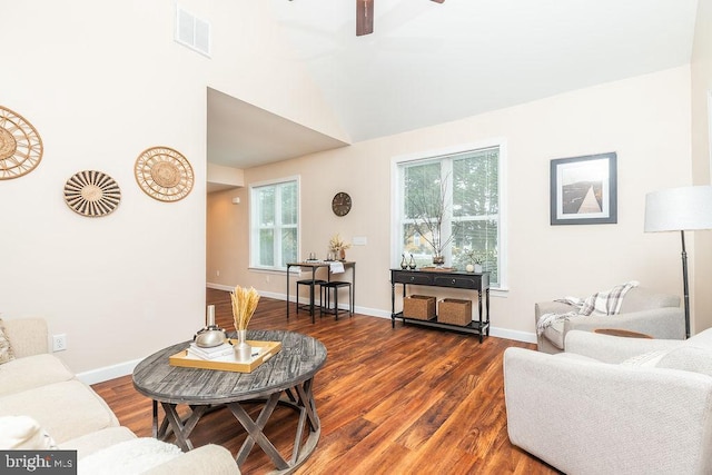 living room with dark wood-type flooring and ceiling fan