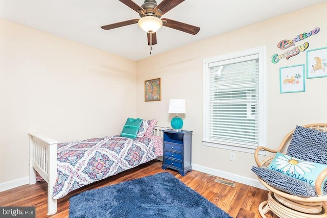 bedroom featuring dark wood-type flooring and ceiling fan