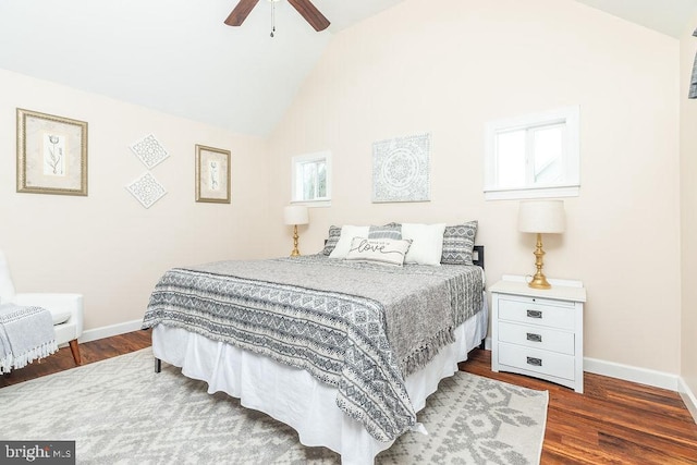 bedroom with ceiling fan, lofted ceiling, and dark hardwood / wood-style floors