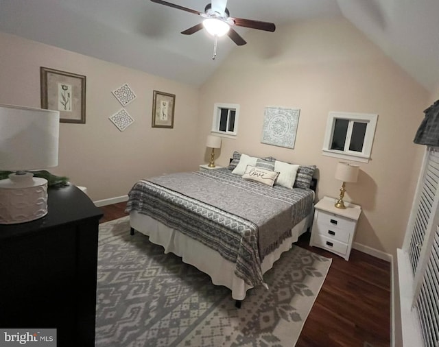 bedroom with ceiling fan, dark hardwood / wood-style floors, a closet, and vaulted ceiling