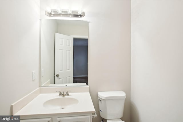 bathroom with toilet and vanity