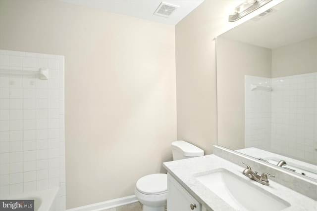 bathroom with baseboards, visible vents, vanity, and toilet