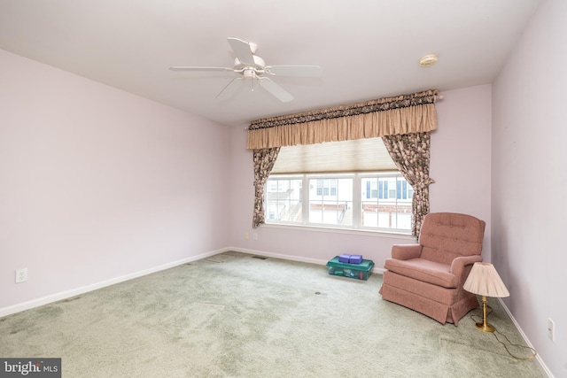 unfurnished room with ceiling fan and carpet floors