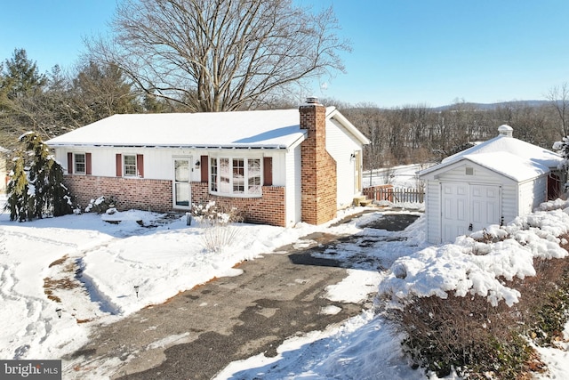 view of front of home featuring a storage shed