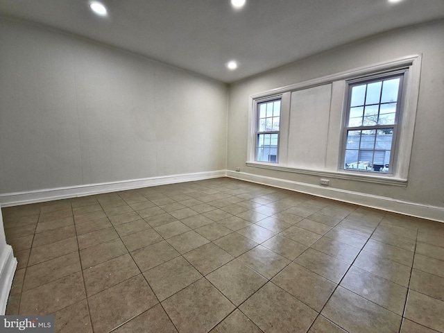 tiled spare room with a wealth of natural light