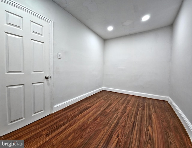 empty room featuring dark hardwood / wood-style flooring