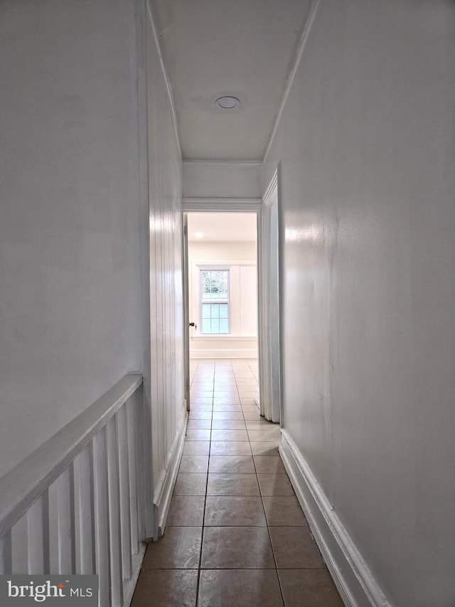 corridor featuring tile patterned floors and radiator