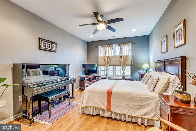 bedroom featuring ceiling fan and hardwood / wood-style floors