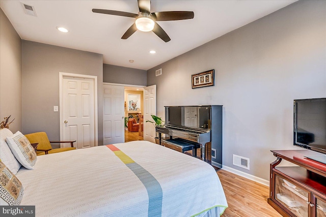 bedroom featuring ceiling fan and light hardwood / wood-style flooring