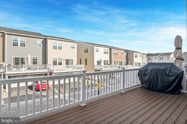 wooden deck with area for grilling