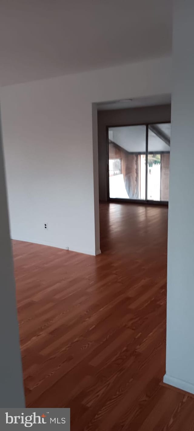 hallway featuring dark wood-type flooring