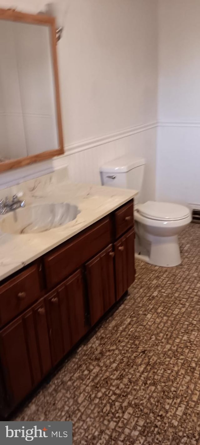 bathroom with vanity and toilet