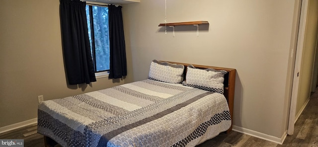 bedroom featuring dark hardwood / wood-style floors