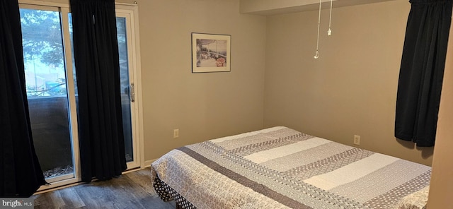 bedroom featuring dark hardwood / wood-style flooring