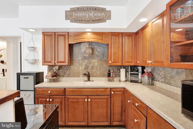 kitchen featuring decorative backsplash and sink