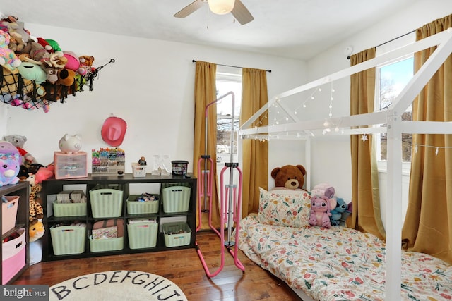 bedroom with ceiling fan and wood-type flooring