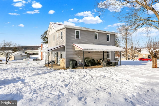 view of snow covered house