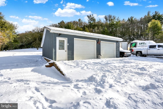 view of snow covered garage