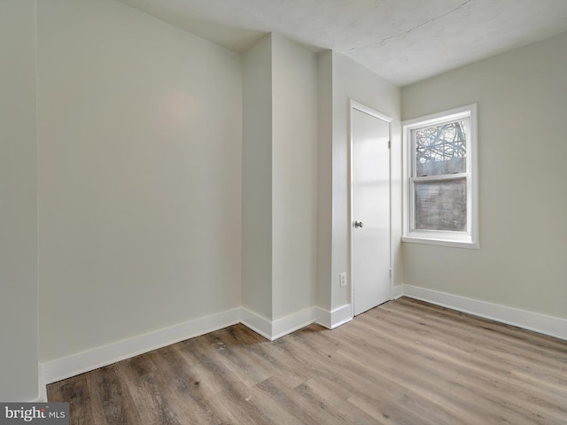 spare room featuring light hardwood / wood-style flooring