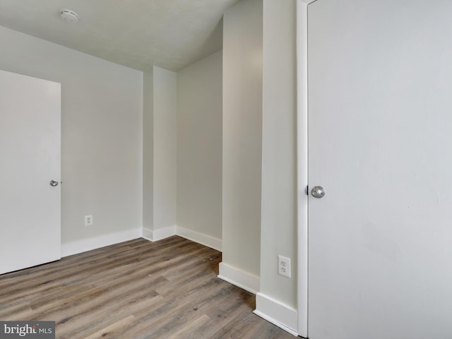 unfurnished room featuring hardwood / wood-style flooring