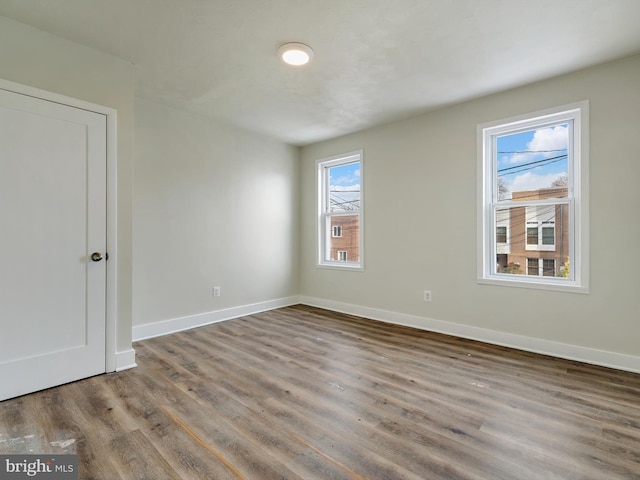 unfurnished room featuring wood-type flooring