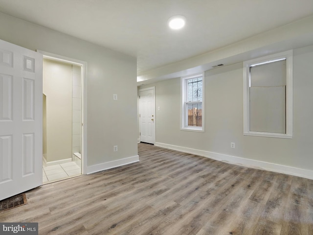 unfurnished room with light hardwood / wood-style floors