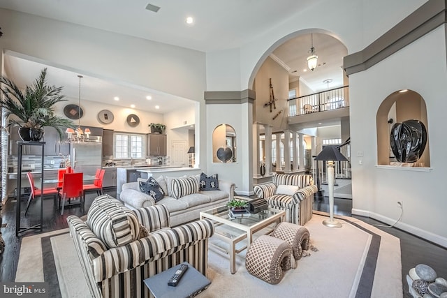 living room with an inviting chandelier