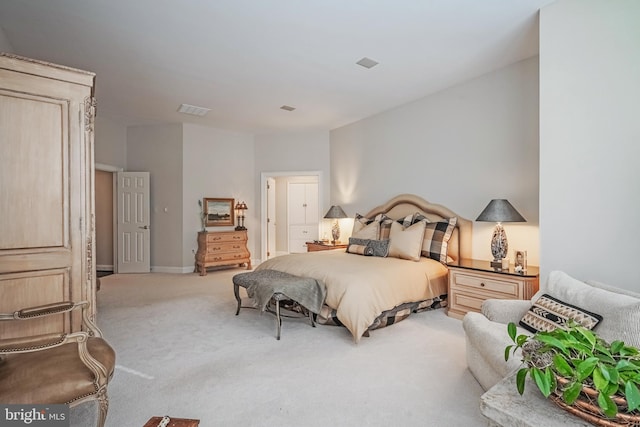 bedroom featuring light colored carpet