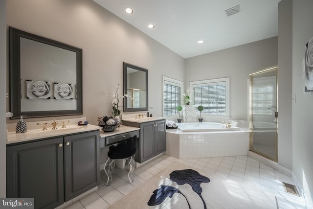 bathroom with tile patterned flooring, vanity, and separate shower and tub