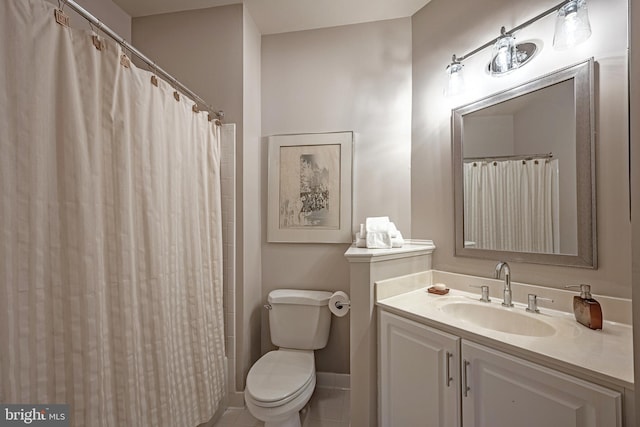 bathroom with vanity, a shower with curtain, tile patterned floors, and toilet