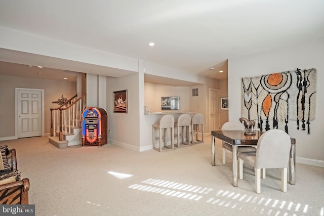 view of carpeted dining space