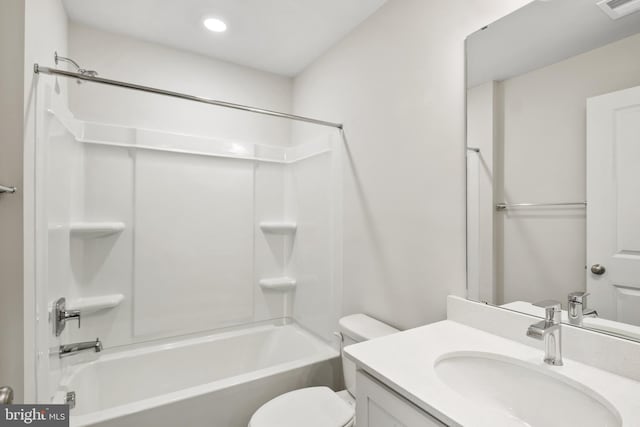 full bathroom with toilet, vanity, and washtub / shower combination