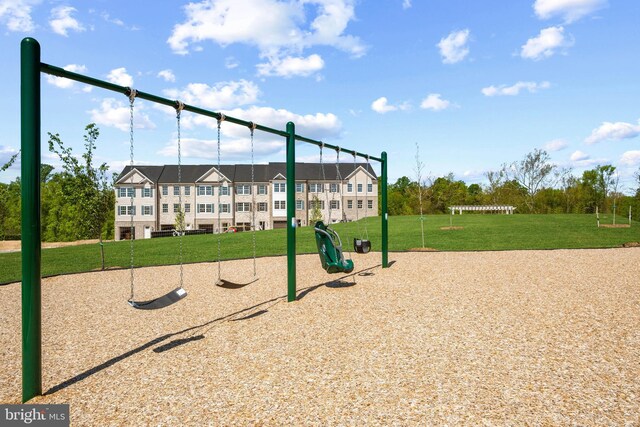 view of playground featuring a lawn