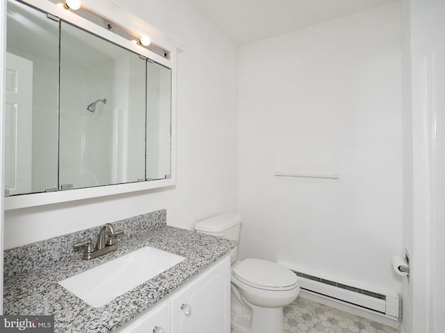 bathroom with toilet, vanity, a shower, and a baseboard radiator