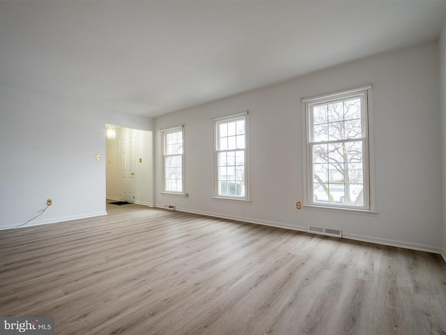 unfurnished room with light hardwood / wood-style flooring