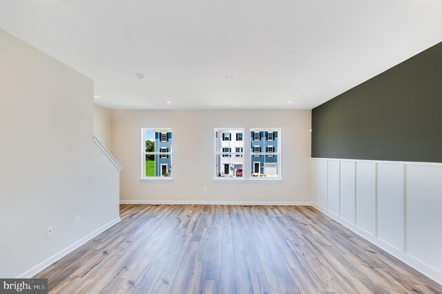 empty room with light hardwood / wood-style floors