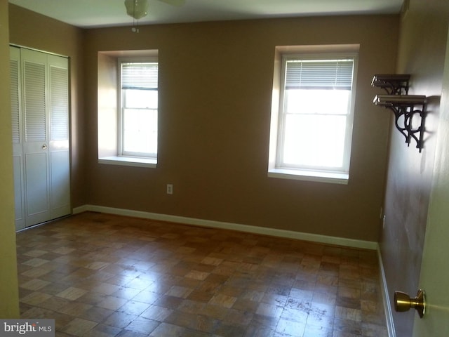 empty room featuring ceiling fan