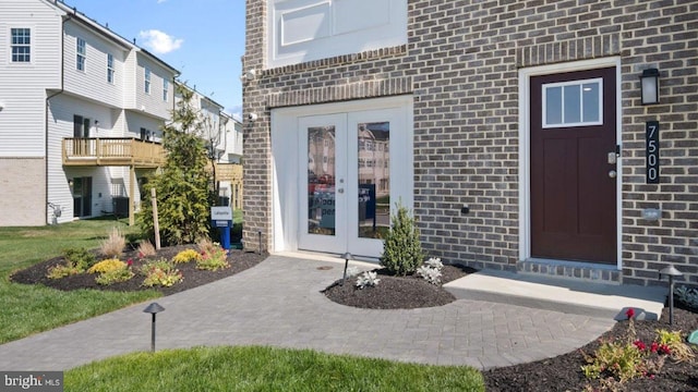 entrance to property featuring french doors