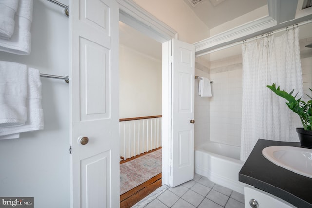 bathroom featuring tile patterned flooring, vanity, and shower / tub combo with curtain