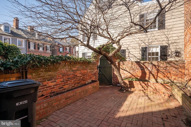 view of patio / terrace featuring a gate and fence