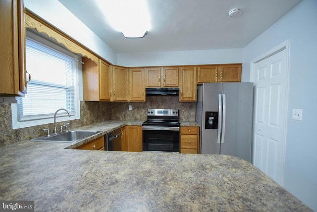 kitchen with tasteful backsplash, stainless steel appliances, and sink